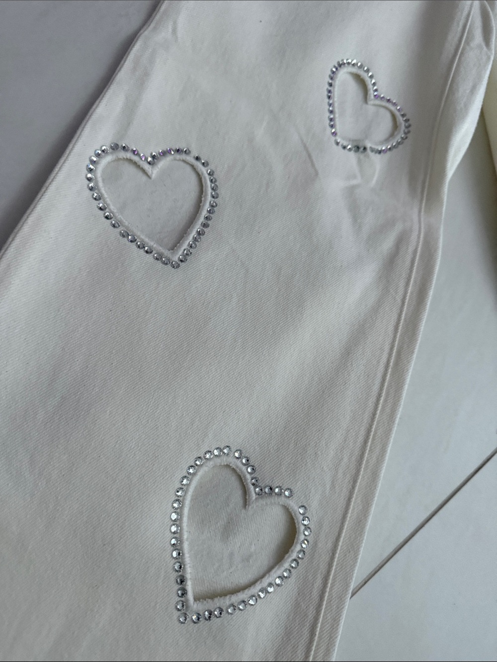 Alice + Olivia White Jeans with crystal heart cutouts. Never worn without tags. - Picture 2 of 5
